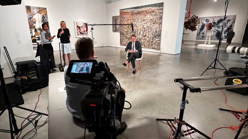 Customer being interviewed at the art gallery